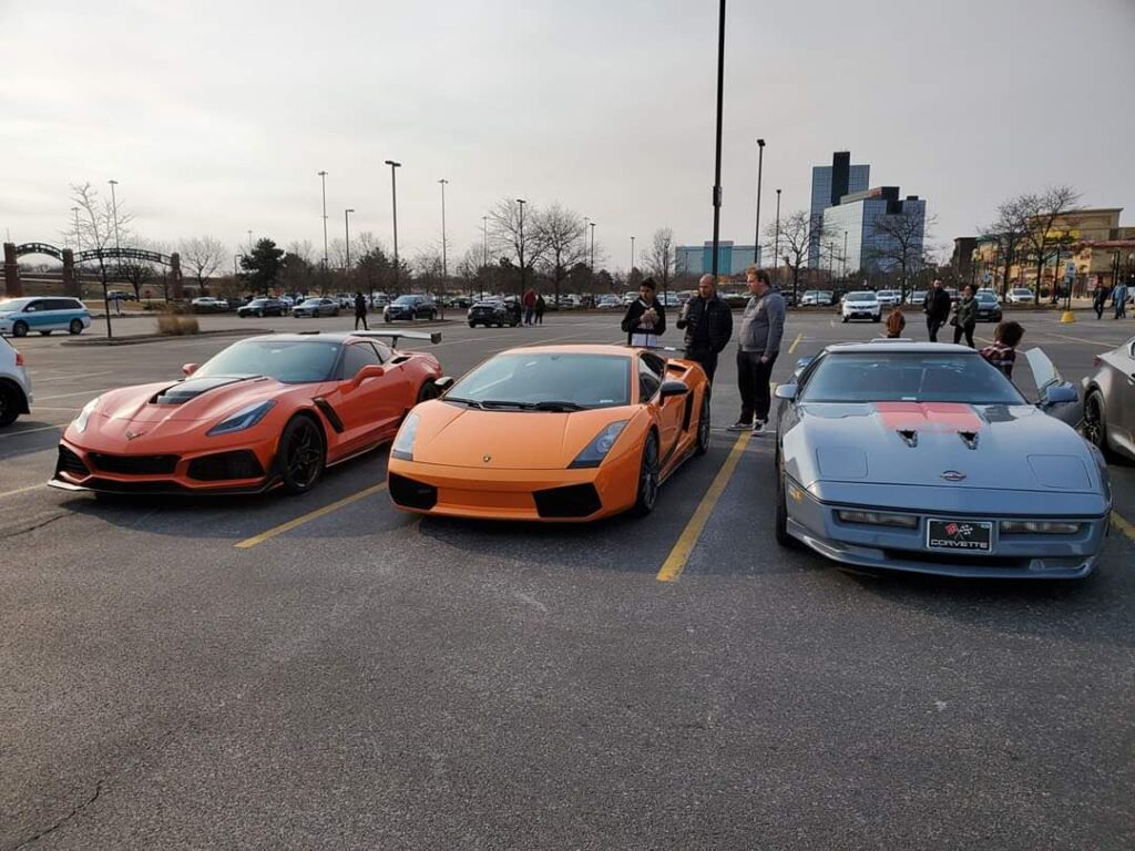 Community gathering and parked cars