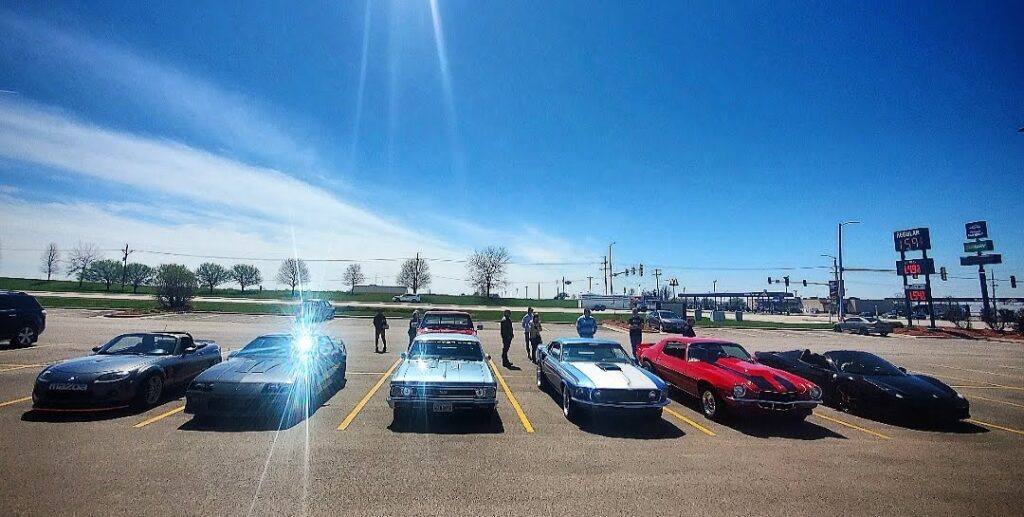 Community gathering and parked cars