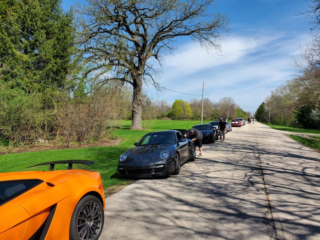 Community gathering and parked cars