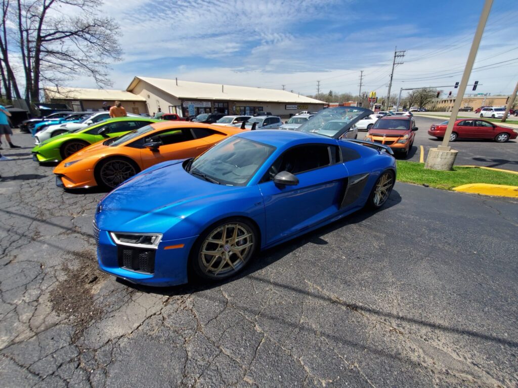 Community gathering and parked cars