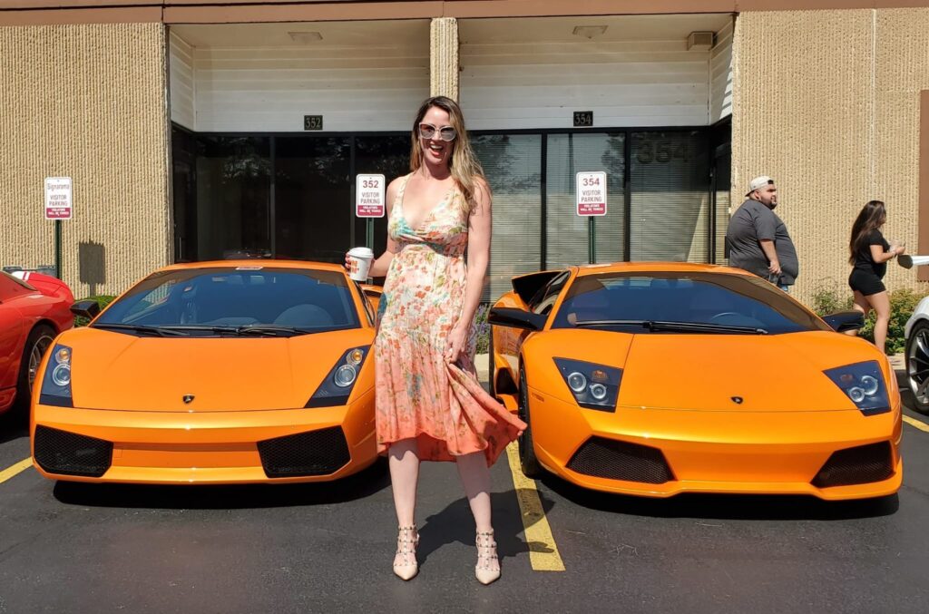 Adult attendee between parked cars