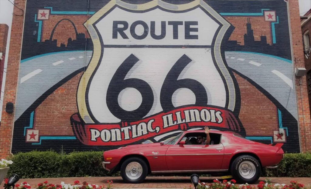 Car by a Route 66 sign