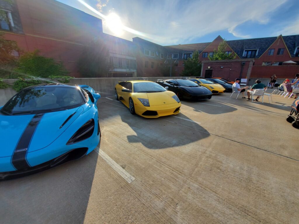 Cars at an outdoor gathering